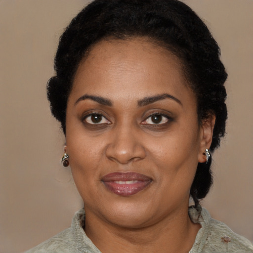 Joyful latino adult female with short  black hair and brown eyes