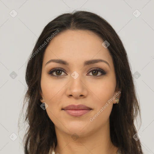 Joyful latino young-adult female with long  brown hair and brown eyes