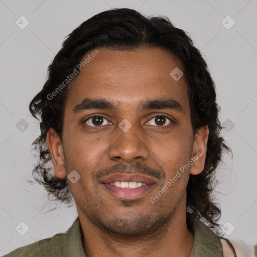 Joyful black young-adult male with short  brown hair and brown eyes