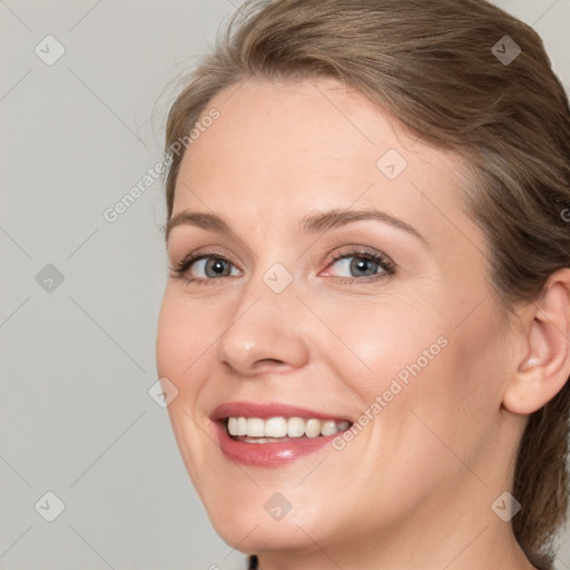 Joyful white young-adult female with medium  brown hair and blue eyes