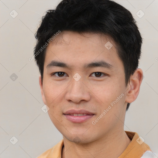 Joyful asian young-adult male with short  brown hair and brown eyes