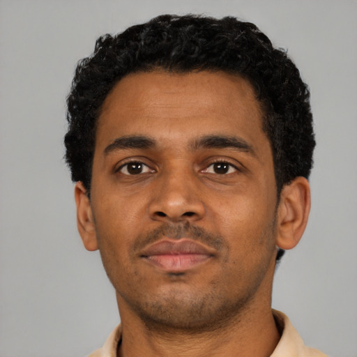 Neutral black young-adult male with short  black hair and brown eyes