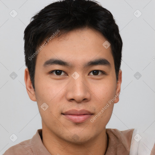 Joyful asian young-adult male with short  brown hair and brown eyes