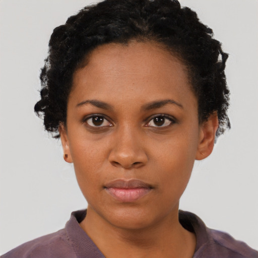 Neutral black young-adult female with short  black hair and brown eyes