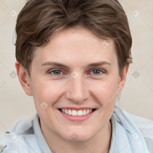 Joyful white young-adult female with short  brown hair and grey eyes