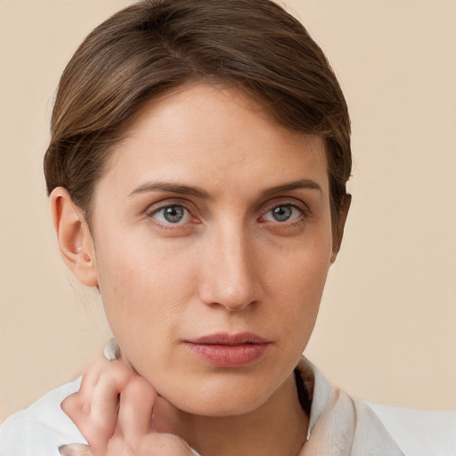 Neutral white young-adult female with short  brown hair and grey eyes