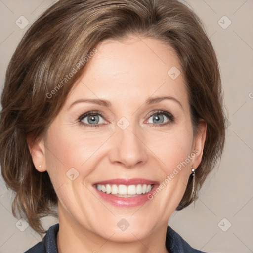 Joyful white adult female with medium  brown hair and grey eyes