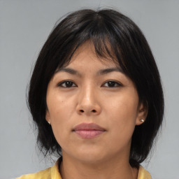 Neutral asian young-adult female with medium  brown hair and brown eyes