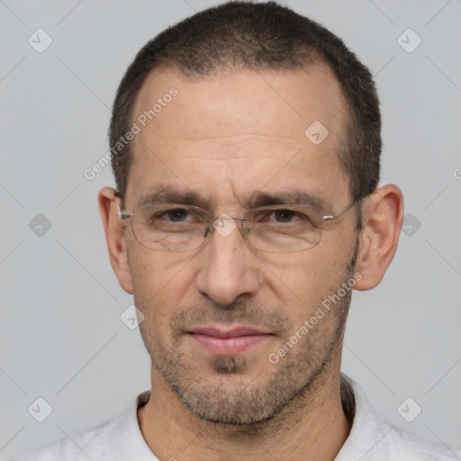 Joyful white adult male with short  brown hair and brown eyes