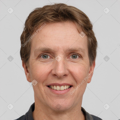 Joyful white adult male with short  brown hair and grey eyes