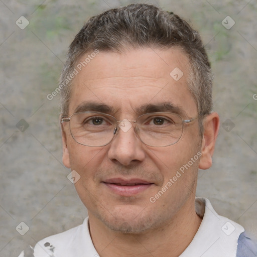 Joyful white adult male with short  brown hair and brown eyes