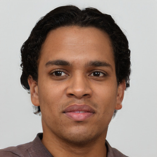 Neutral latino young-adult male with short  brown hair and brown eyes