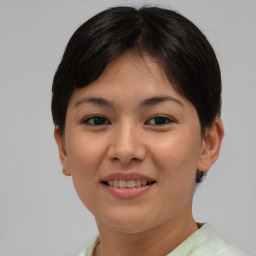 Joyful asian young-adult female with short  brown hair and brown eyes