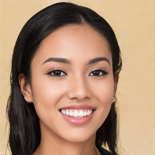 Joyful white young-adult female with long  black hair and brown eyes