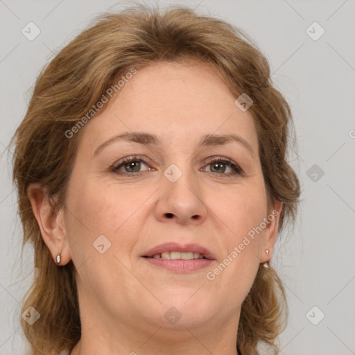 Joyful white adult female with medium  brown hair and grey eyes