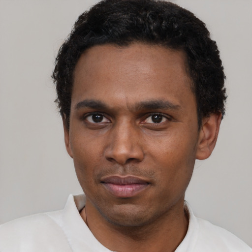 Neutral black young-adult male with short  black hair and brown eyes