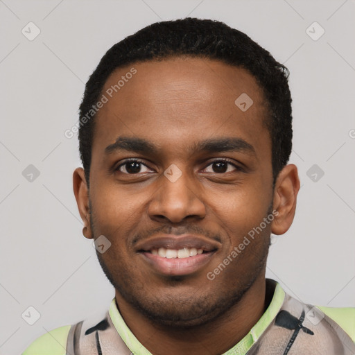 Joyful black young-adult male with short  black hair and brown eyes