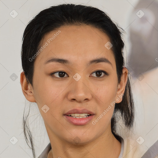 Joyful asian young-adult female with medium  black hair and brown eyes