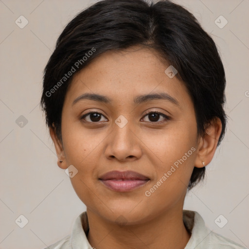 Joyful latino young-adult female with medium  brown hair and brown eyes