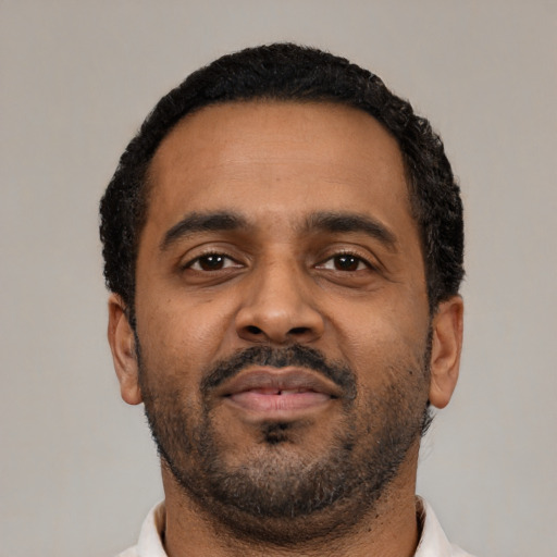 Neutral latino adult male with short  black hair and brown eyes
