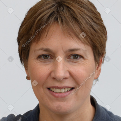 Joyful white adult female with medium  brown hair and grey eyes