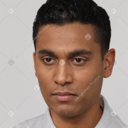Neutral latino young-adult male with short  black hair and brown eyes