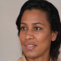 Joyful black adult female with medium  brown hair and brown eyes