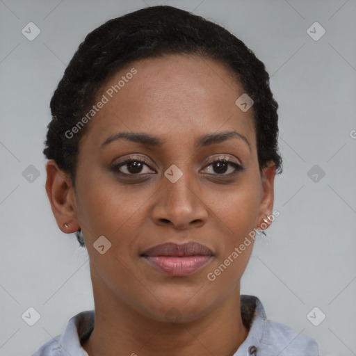 Joyful black young-adult female with short  brown hair and brown eyes