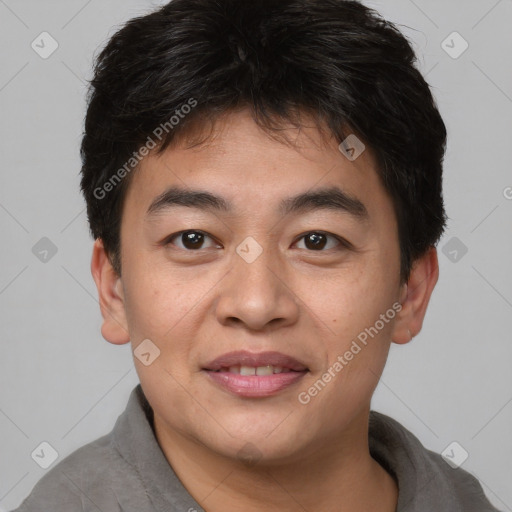 Joyful asian young-adult male with short  brown hair and brown eyes