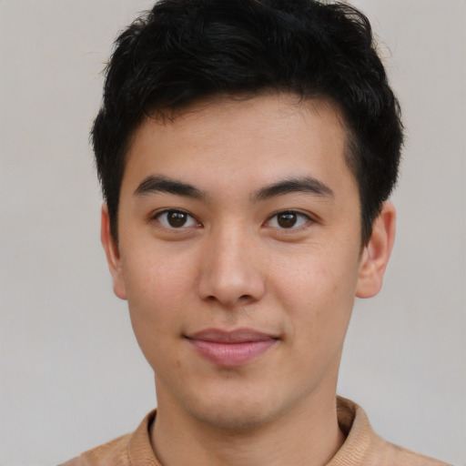 Joyful latino young-adult male with short  brown hair and brown eyes