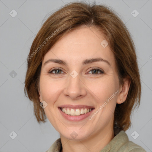 Joyful white adult female with medium  brown hair and brown eyes