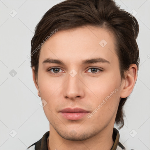 Neutral white young-adult male with short  brown hair and brown eyes