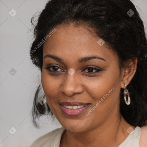 Joyful black young-adult female with long  brown hair and brown eyes