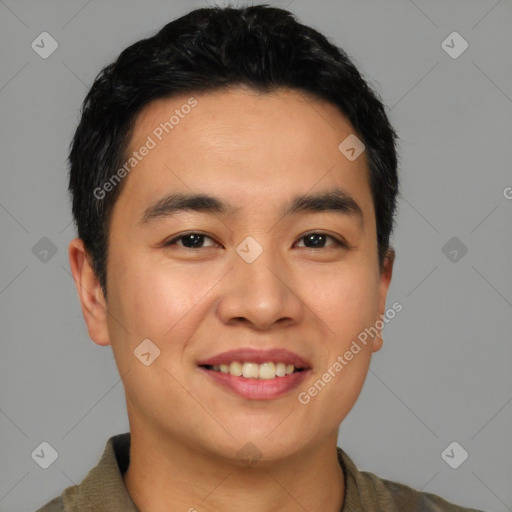 Joyful asian young-adult male with short  black hair and brown eyes