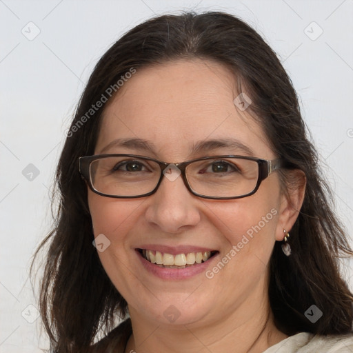 Joyful white adult female with medium  brown hair and brown eyes