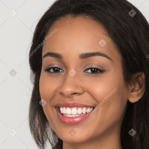 Joyful latino young-adult female with long  brown hair and brown eyes