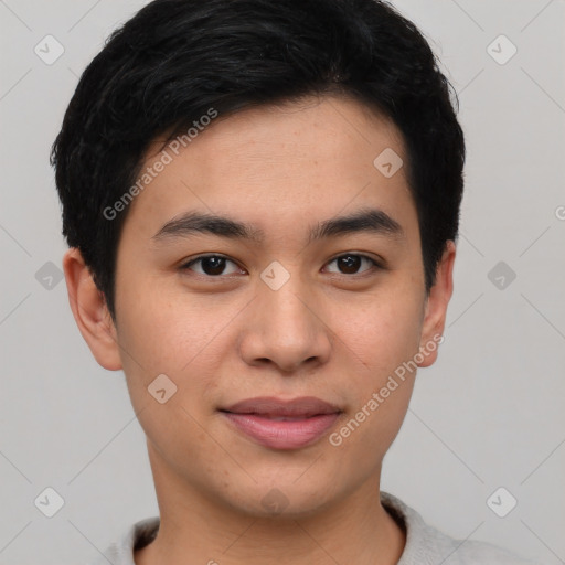 Joyful asian young-adult male with short  black hair and brown eyes