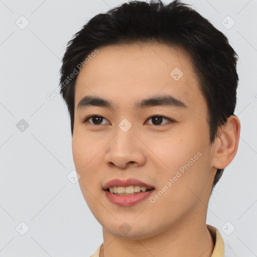 Joyful asian young-adult male with short  black hair and brown eyes