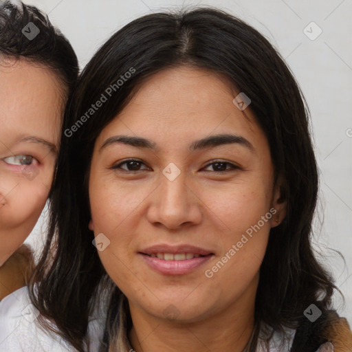 Joyful latino young-adult female with medium  brown hair and brown eyes