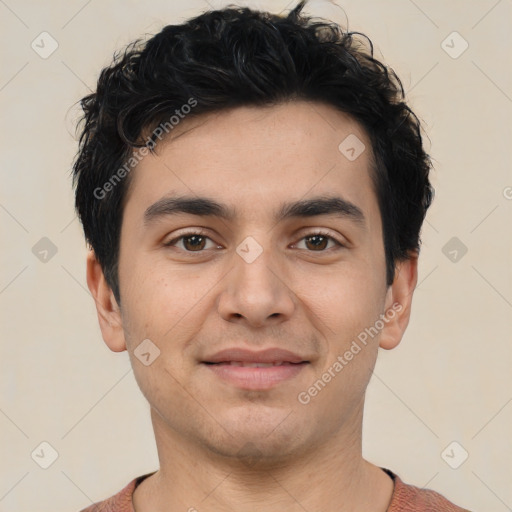 Joyful asian young-adult male with short  black hair and brown eyes