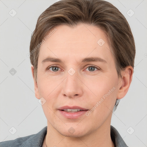 Joyful white adult male with short  brown hair and grey eyes