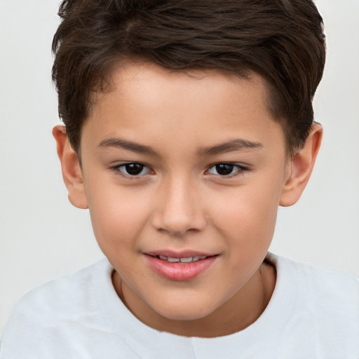 Joyful white child male with short  brown hair and brown eyes