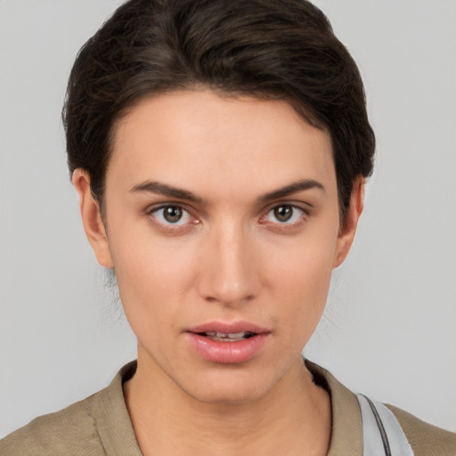 Neutral white young-adult female with short  brown hair and brown eyes