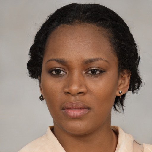 Neutral black young-adult female with medium  black hair and brown eyes