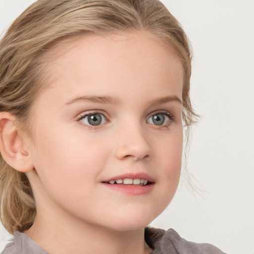 Joyful white child female with medium  brown hair and blue eyes