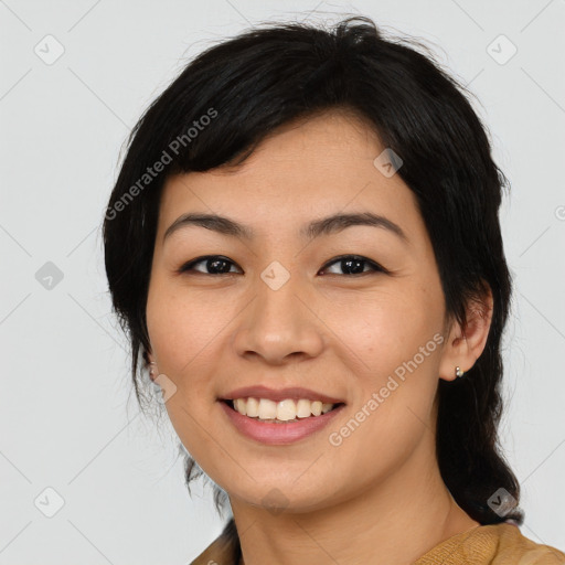 Joyful asian young-adult female with medium  black hair and brown eyes