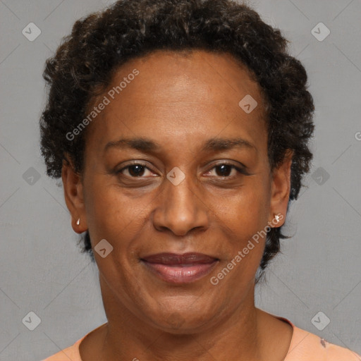 Joyful black adult female with short  brown hair and brown eyes