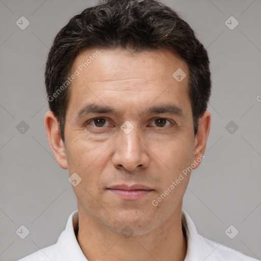 Joyful white adult male with short  brown hair and brown eyes