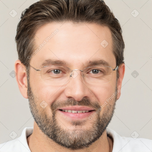 Joyful white adult male with short  brown hair and brown eyes