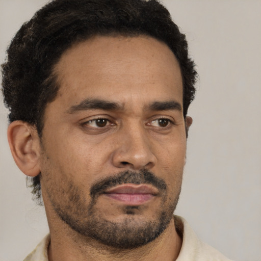 Neutral black adult male with short  black hair and brown eyes